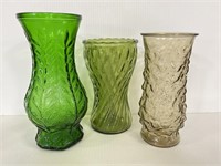 Trio of green and brown glass flower vases
