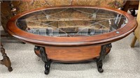 Oval glass top coffee table (48"L x 32"D x
