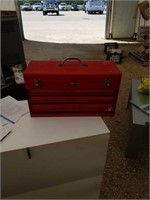 Red toolbox with assorted items
