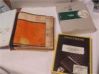 Two John Deere manuals and a case manual