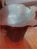 Wooden tree stump end table top is loose