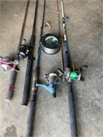 Assortment of fishing rods spool of fishing line