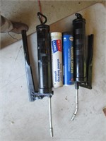 two grease guns, grease cartridges