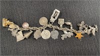 Charm bracelet, some sterling charms