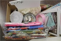 box of panels, lace, buttons, cd, ribbon, etc