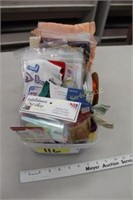 box of needles, thimble, zippers, decor, ribbon,
