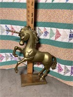 Old brass unicorn figure
