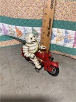 Cast iron Michelin man on motorcycle