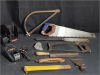 Group of assorted saws, chargers, etc.