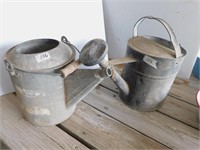 Pair of galvanized watering cans