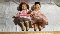 2 girl dolls in pink dresses