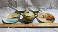Hand painted tea pot and 2 cups and saucers