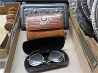 2 wallets, wire rimmed glasses