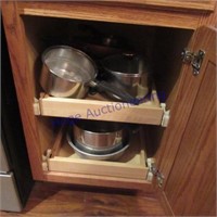 CONTENTS OF CUPBOARD-PANS, LIDS, STRAINER