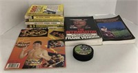 (D) assorted sports books and puck