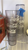 7 plastic Coca Cola cups