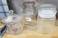 Three Covered Clear Glass Cannisters