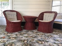 2 Red Wicker Chairs and a Side table