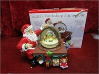Mr. Christmas Santa's Workshop snow globe.