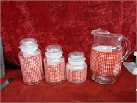 (12)Red Gingham Pitcher & Canisters. Fire King.