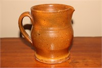 Redware Pitcher  5" tall (chip on spout)