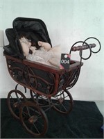 Vintage doll stroller with doll