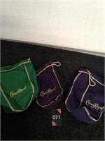Three Crown Royal bags