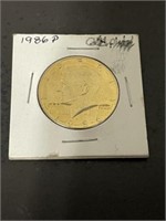 1986 P PLATED KENNEDY HALF DOLLAR