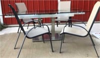 Glass top patio table with tuck in end extended