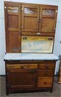 Antique kitchen cabinet with caramel slag glass