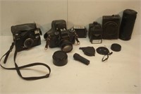 Three Cameras and Related - Yashica - Minolta