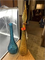 Tall glass decanters, blue one made in Italy.