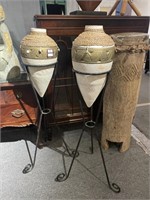 Pair of white urns with stands