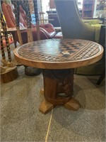 Carved checker top round table