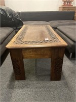 Carved wood coffee table