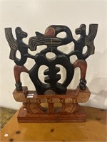 Red and black carved figure