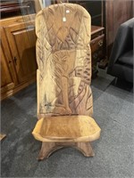 Carved wooden palaver chair with lion