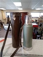 Stainless steel thermos with leather carrier