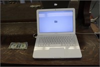 White MacBook Model A1342 with charger