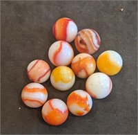Group of vintage swirl marbles orange yellow