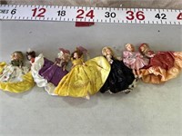 9 plastic dolls
