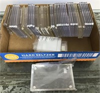 Hard plastic trading card protectors - pre-owned