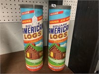 2 CANS OF AMERICAN LOGS
