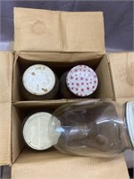 4 glass gallon jugs in box