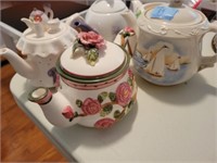 5 CERAMIC TEA POTS - ONE IS CHIPPED