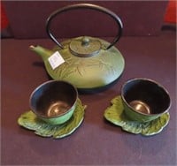 ASIAN DESIGN CAST IRON TEA POT AND 2 CUPS/SAUCERS