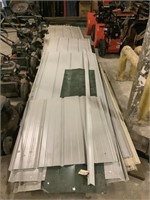 Assorted sheets of metal roofing