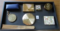 Tray of Compacts, Fan, Collapsable Cup, Pill Box