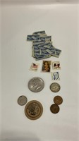 Variety of collectable stamps and coins