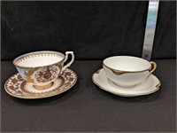 TWO TEACUPS AND SAUCERS